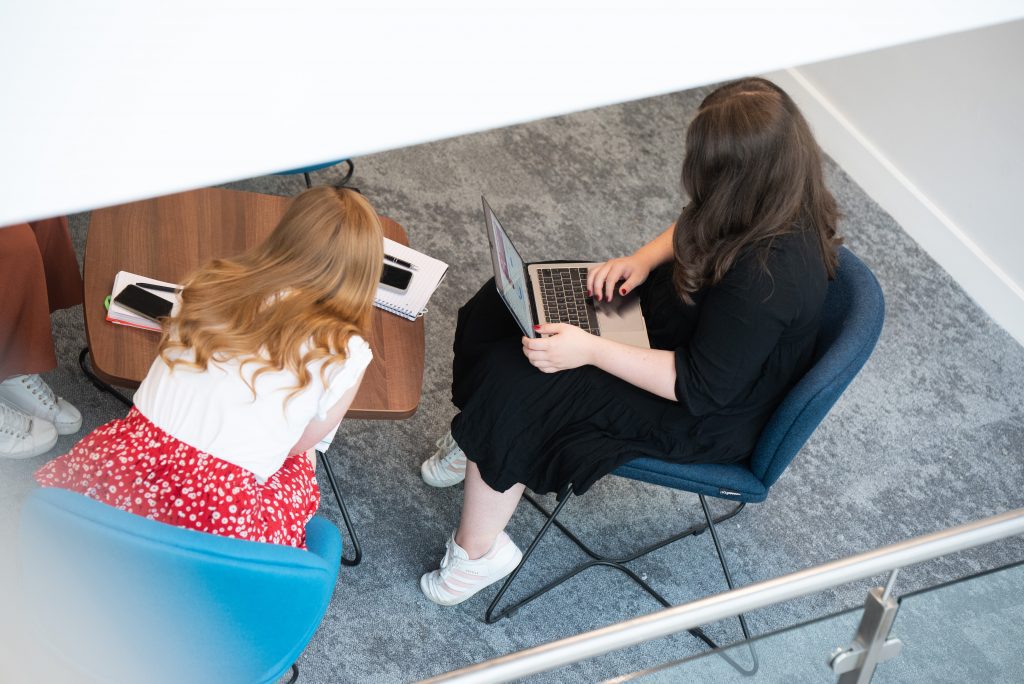 Group of students sat working together